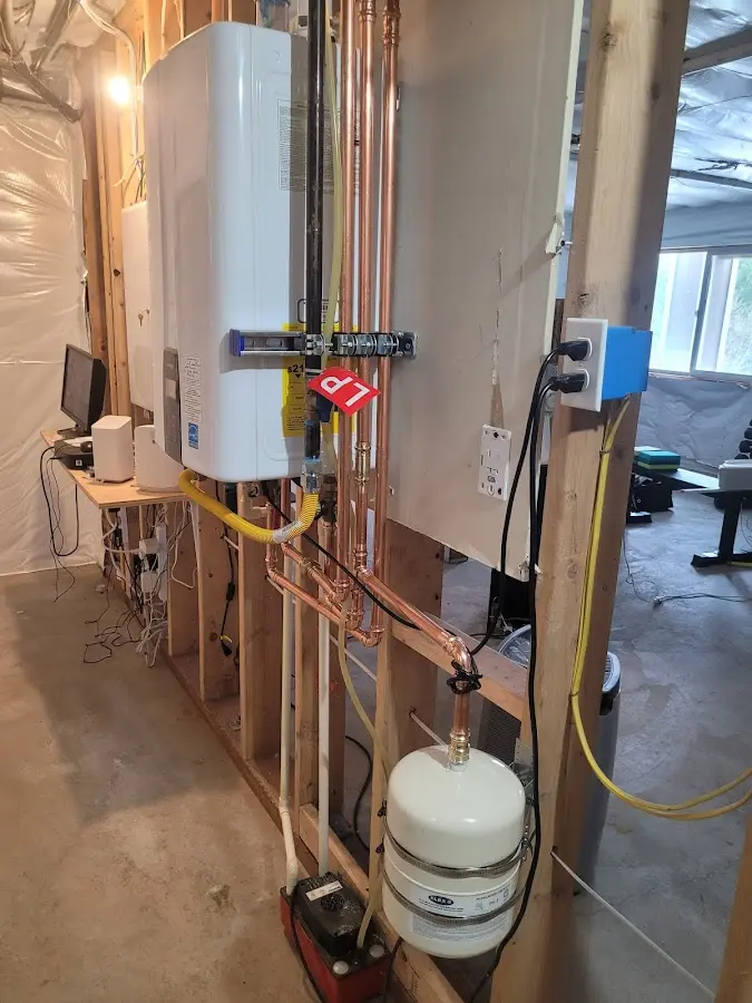 Licensed plumber repairing a kitchen sink in Harrison